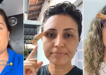 Mulher de blusa azul com pregador de madeira na sobrancelha demonstra truque viral contra enxaqueca